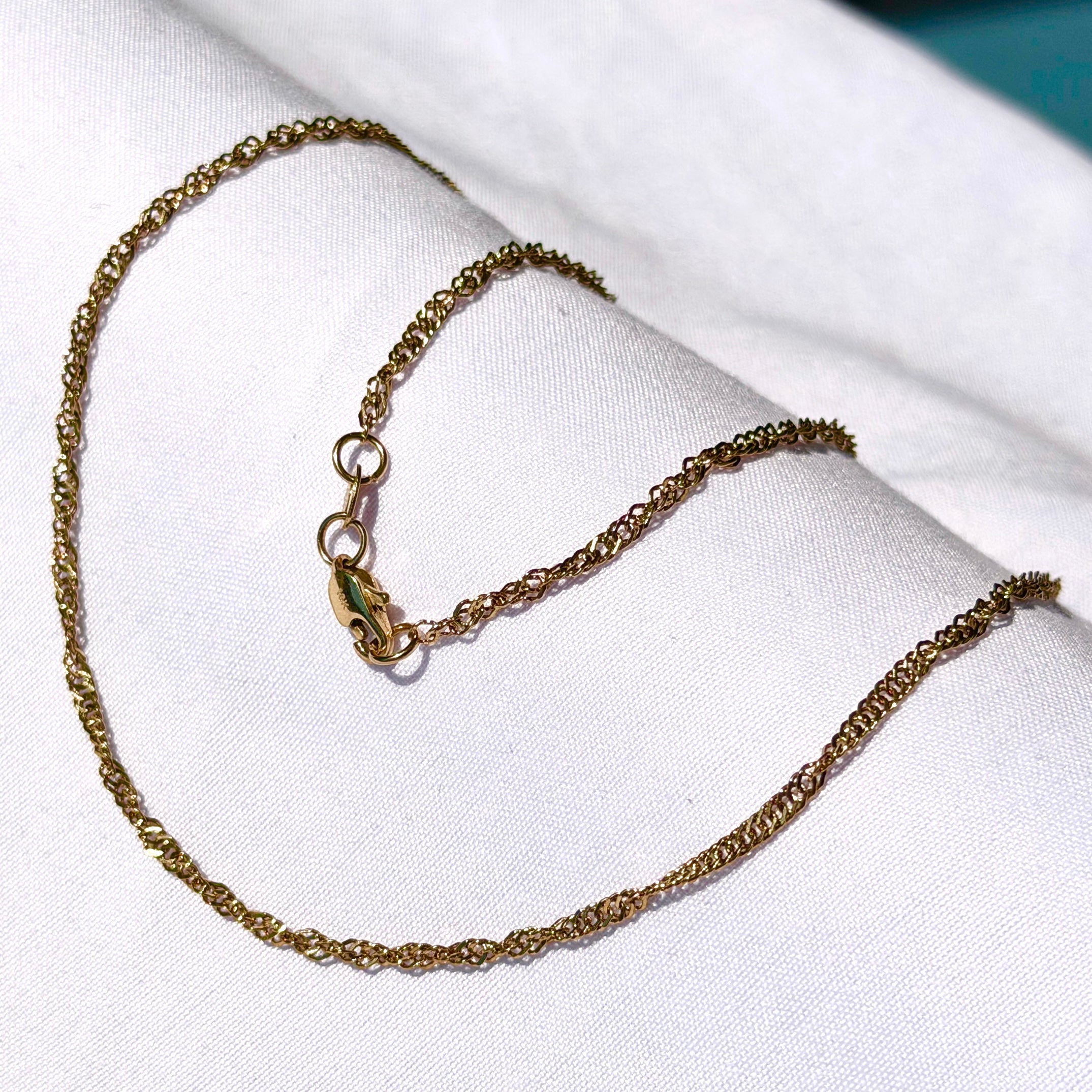 Cadena Singapur Mujer